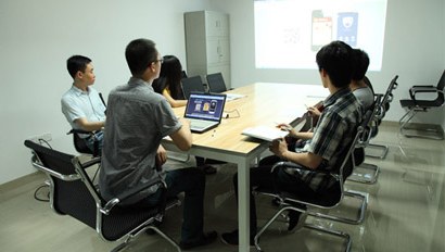 About UnivFitness UnivFitness team discussing OEM fitness equipment projects in meeting room