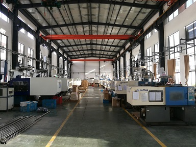 About UnivFitness Fitness equipment production workshop with injection molding machines at UnivFitness factory